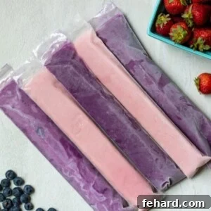 Fruit and Yogurt Tubes beautifully arranged on a clean white counter, highlighting their freshness and appeal.