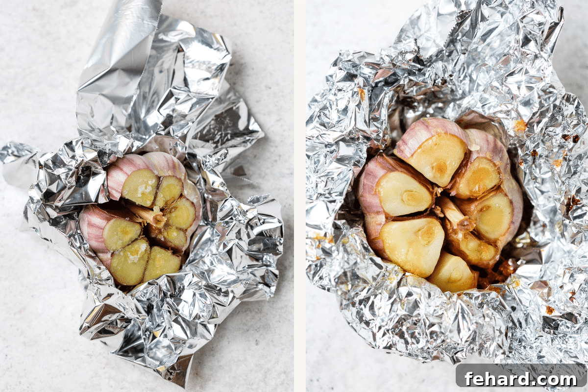 A whole head of garlic, trimmed and drizzled with olive oil, being carefully wrapped in aluminum foil before roasting.