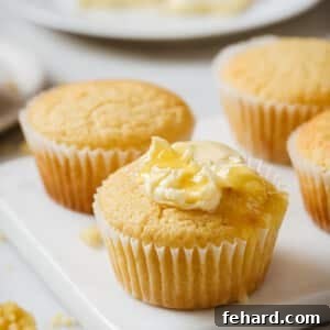 closeup view of cornmeal muffins on a marble platter.