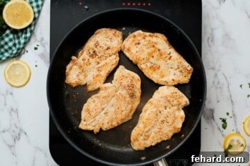 Zesty Honey-Glazed Skillet Chicken 5 Pan seared chicken cutlets in skillet.