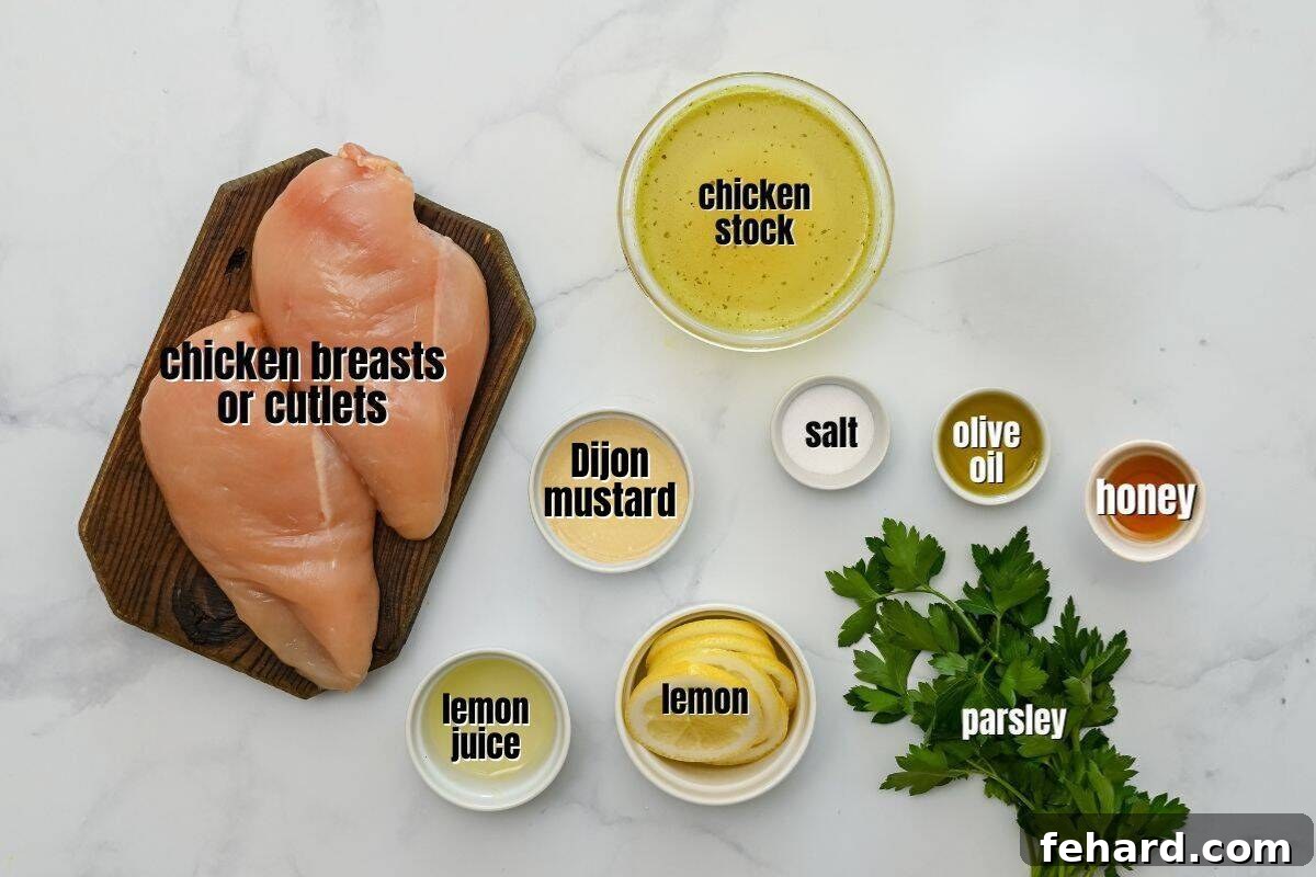Honey Lemon Chicken Recipe Arrangement of fresh ingredients for honey lemon chicken, including chicken breasts, lemons, honey, mustard, and stock.