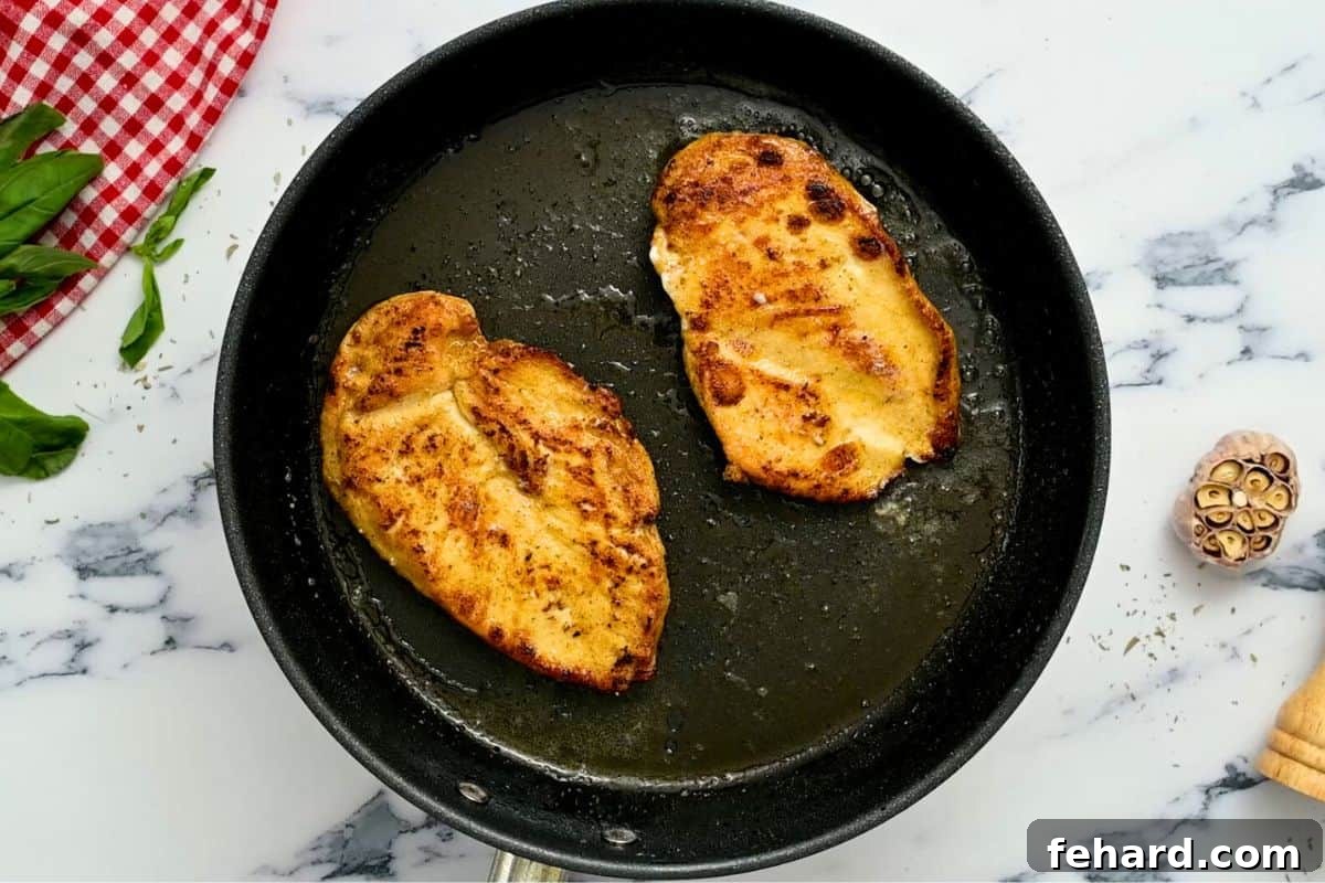 Marry Me Chicken Skillet - Seared Chicken Beautifully seared chicken cutlets resting in a skillet, awaiting the addition of the creamy sauce for the Marry Me Chicken recipe.