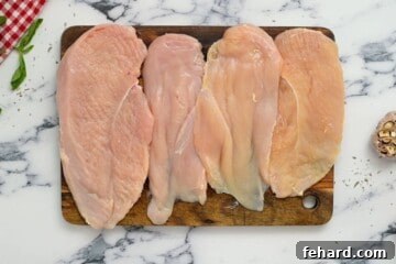 Proposal-Worthy Chicken 3 4 chicken cutlets pounded thin on cutting board.