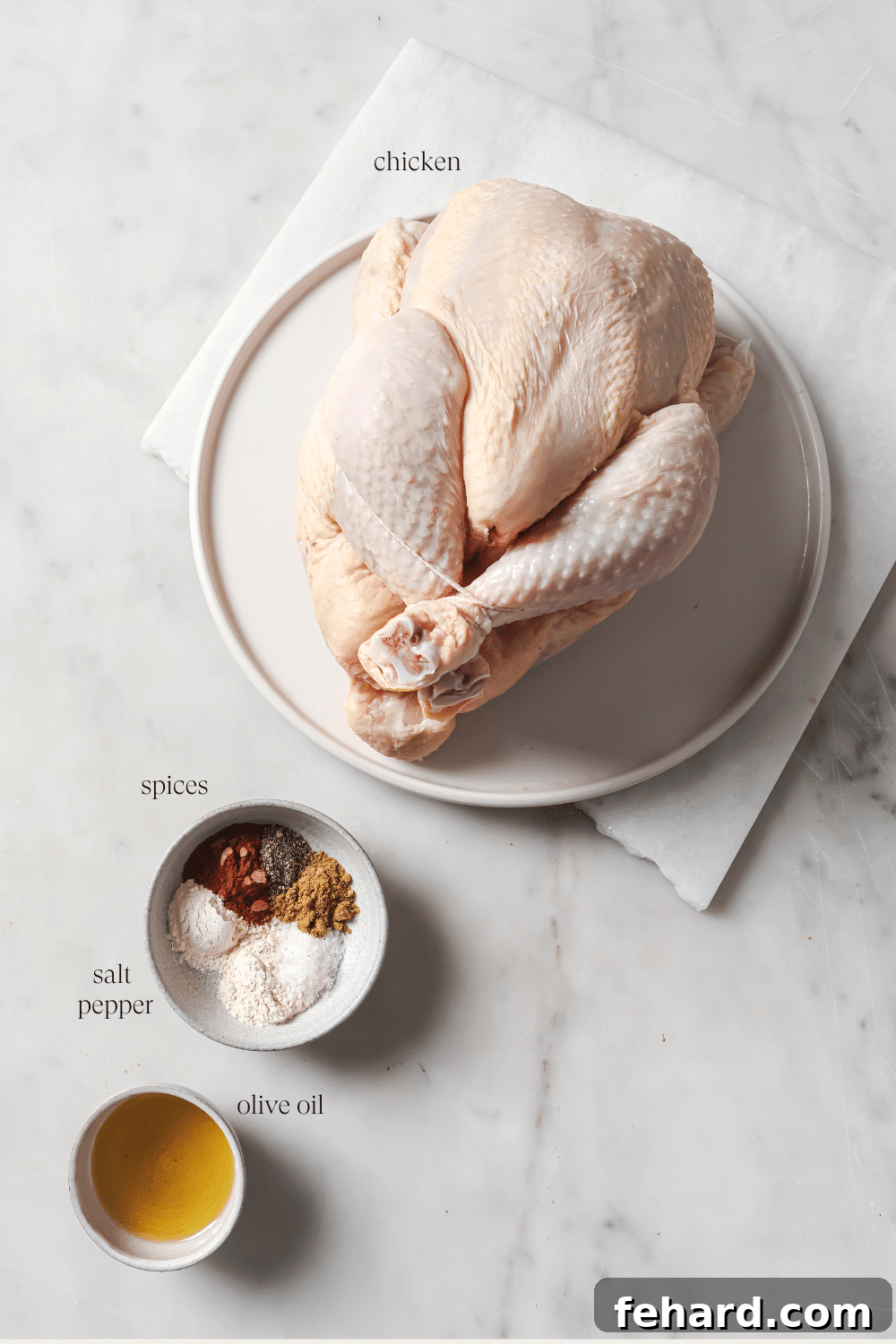 Pre-measured ingredients to season the chicken, including a bowl of spices and cooking oil.