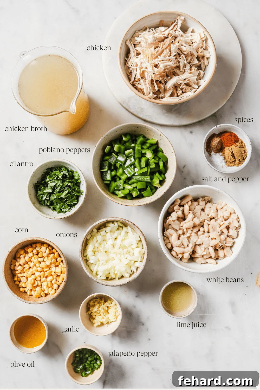 Pre-measured ingredients for White Chicken Chili in small bowls, including beans, broth, spices, and vegetables.