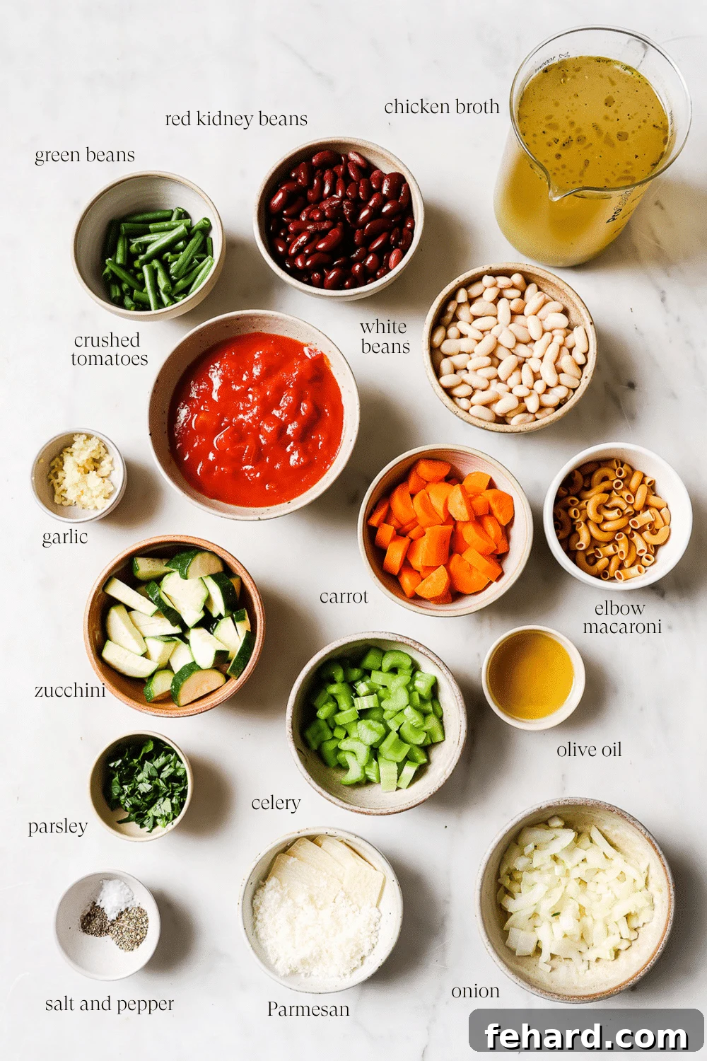Hearty Vegetable Minestrone 3 Small bowls of pre-measured ingredients, showcasing the freshness and variety used in Minestrone soup.