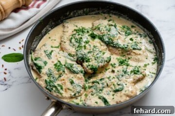 Creamy Florentine Chicken 9 Plated Chicken Florentine, garnished with fresh parsley and ready to be enjoyed.