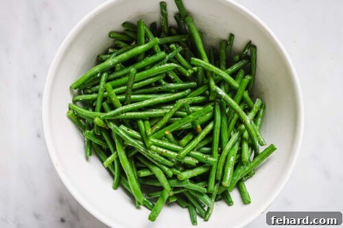 Crispy Air Fried Green Beans 11 Air Fryer Green Beans in a white bowl