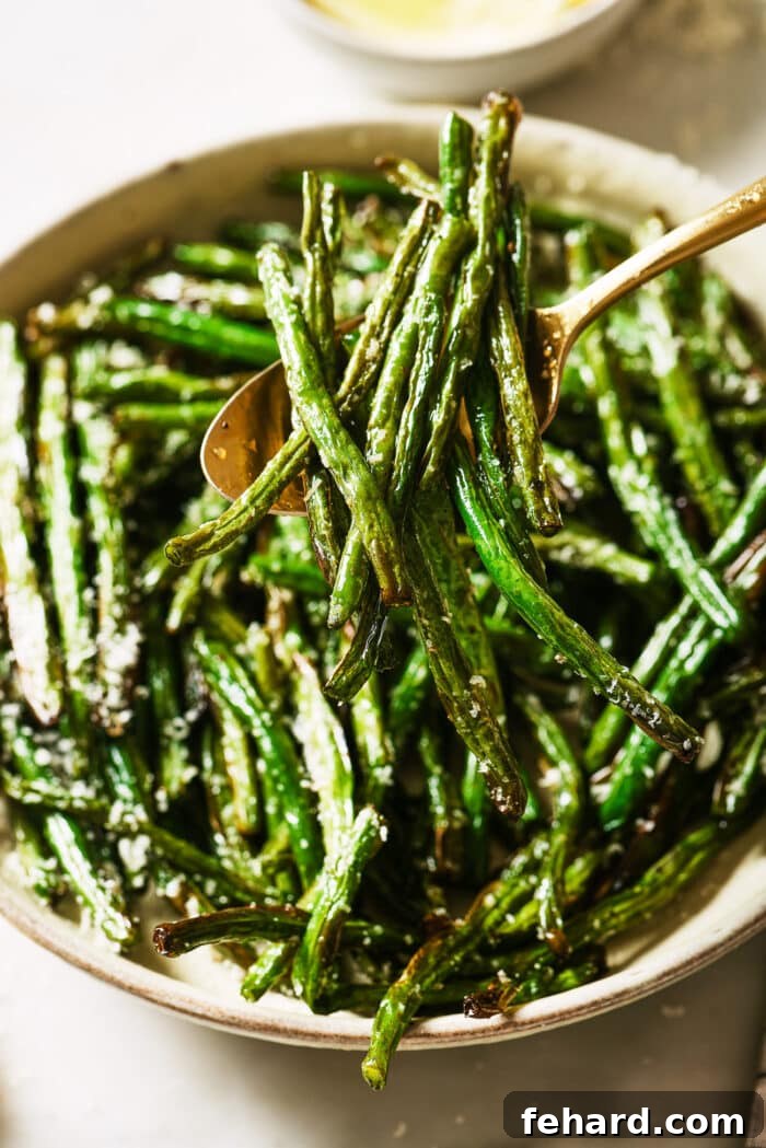 Crispy Air Fried Green Beans 7 Close up of air fryer green beans in a serving bowl.