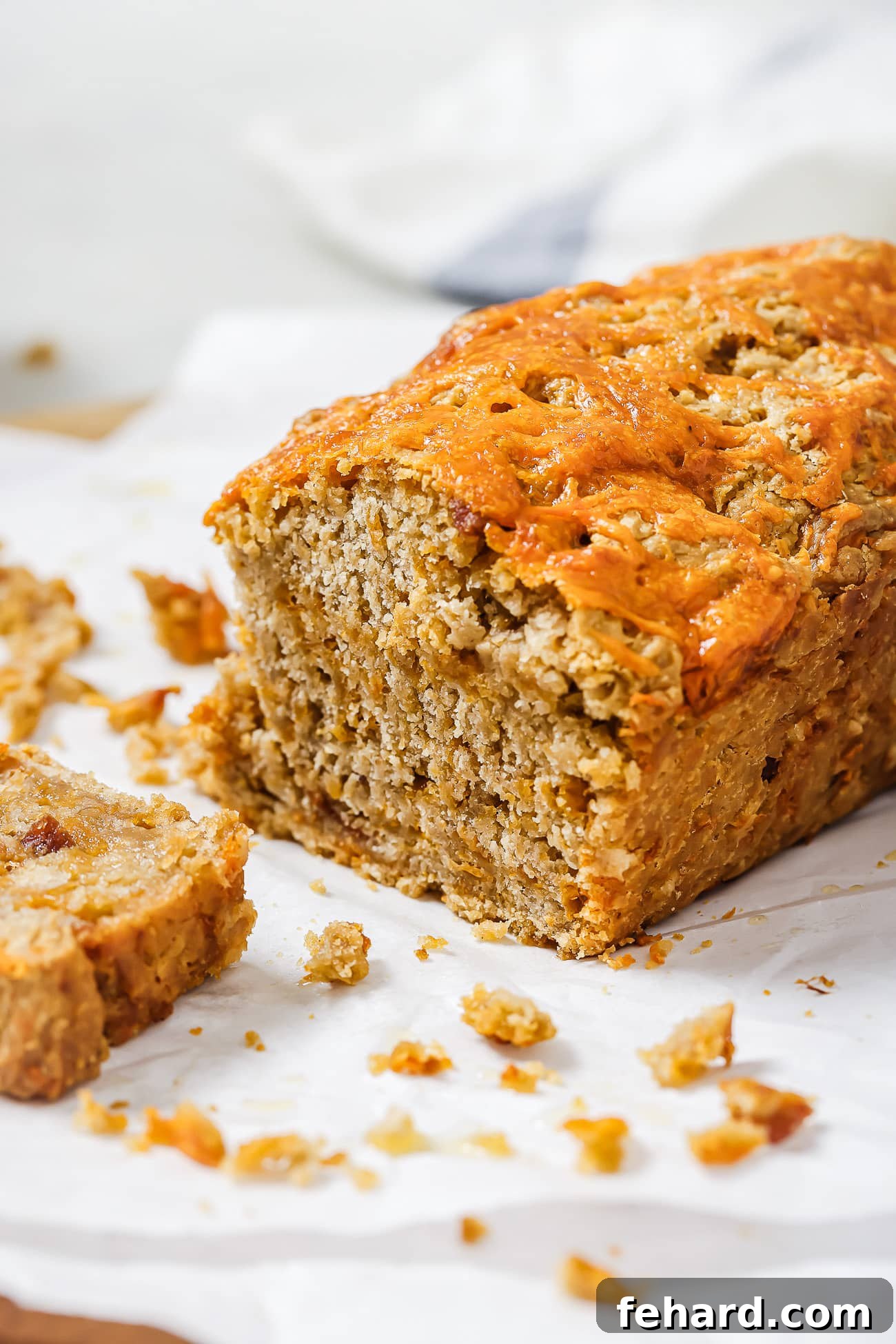A close up of freshly sliced beer bread, perfectly golden and featuring visible savory fillings, ready to be served.
