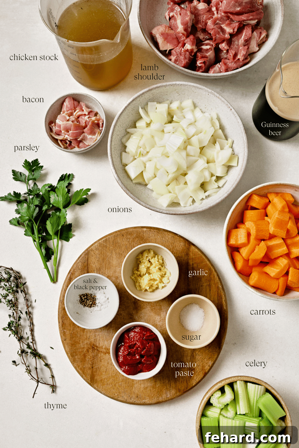 Pre-measured ingredients in small bowls on a white countertop.