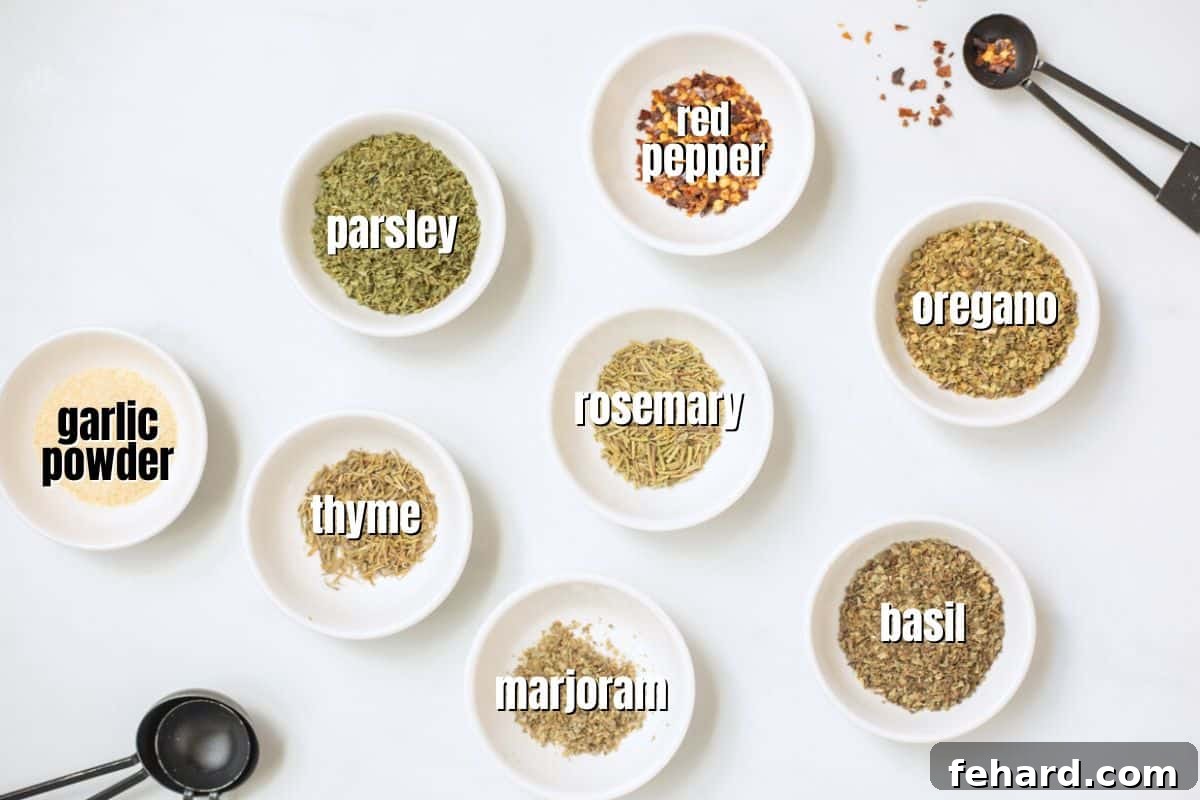 Individual spices for homemade Italian seasoning, clearly labeled on a kitchen counter.