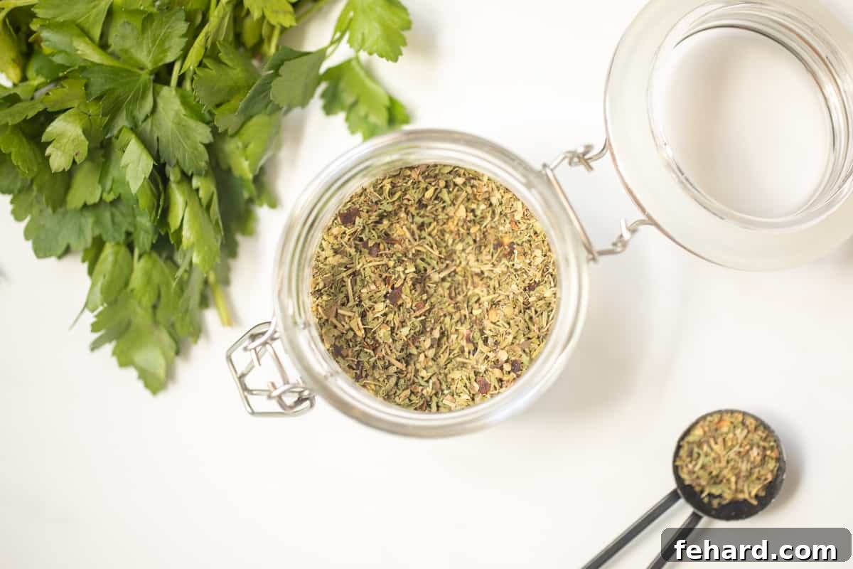 A sealed jar of homemade Italian Seasoning resting on a counter, ready for long-term storage.