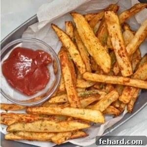 Basket of homemade fries served with ketchup that were made in Air Fryer French Fries.