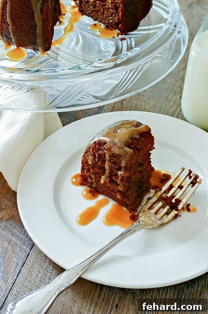 Decadent Chocolate Bundt Cake with Golden Salted Caramel Glaze, garnished with sea salt flakes