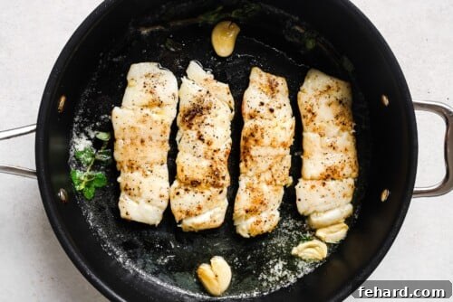 Pan-Seared Garlic Butter Haddock 13 Garlic Butter Haddock in a skillet