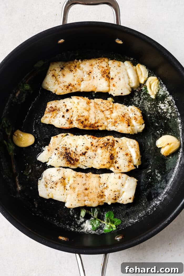 Pan-Seared Garlic Butter Haddock 7 Garlic Butter Haddock in a skillet