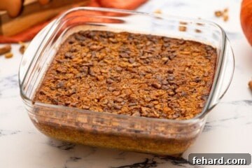 Baked Pumpkin oatmeal in glass baking dish on counter.