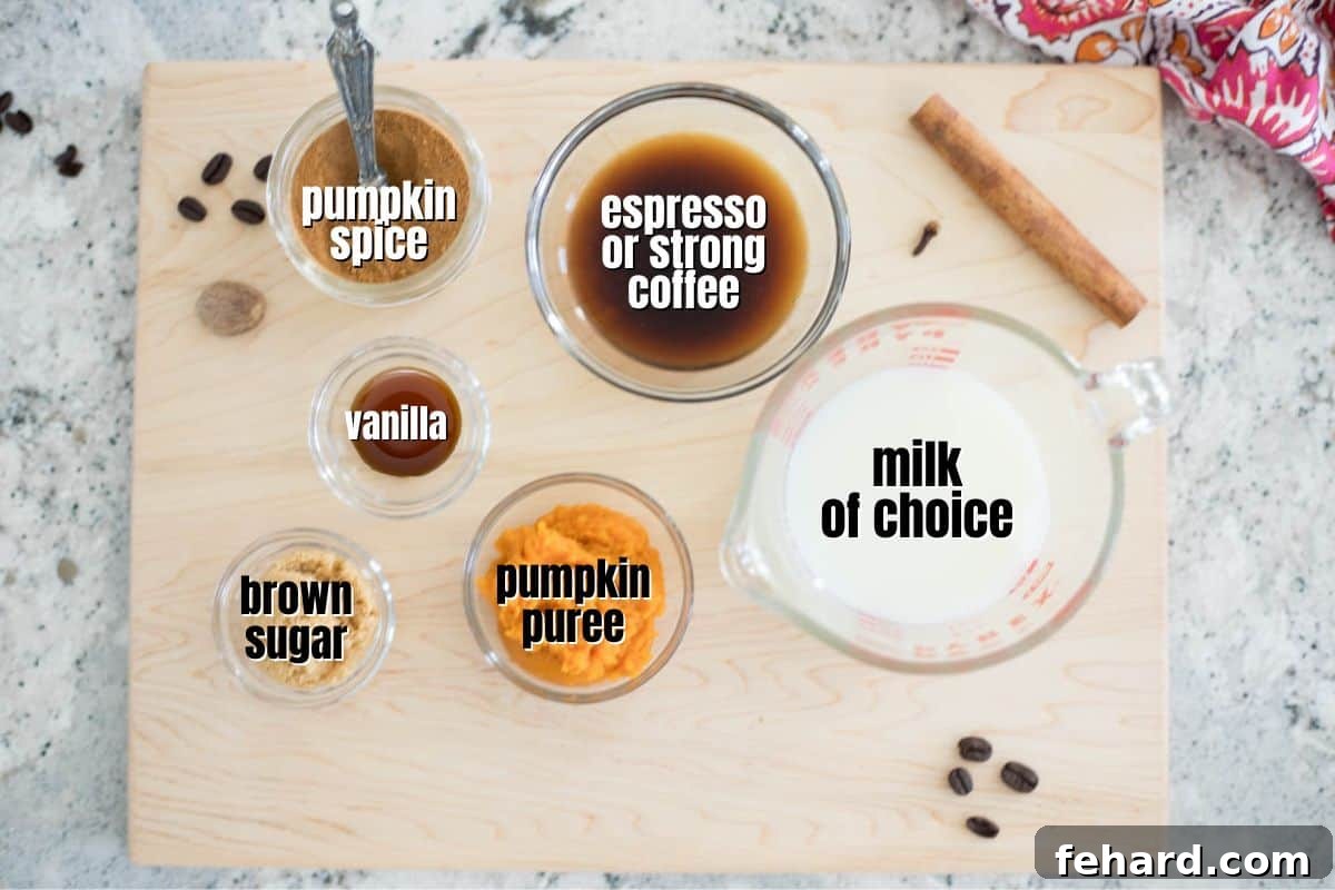 Labeled ingredients for homemade pumpkin spice latte laid out on a rustic wooden cutting board, showcasing fresh, wholesome components.