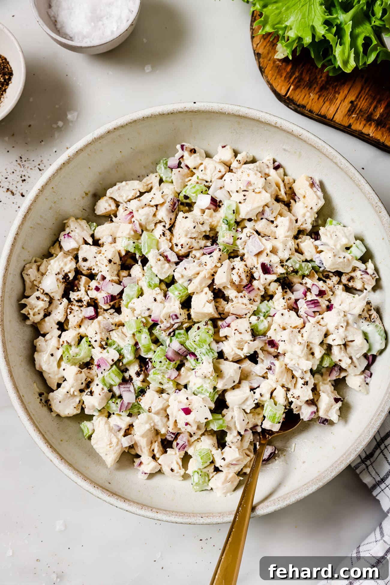 Signature Chicken Salad 5 An inviting overhead view of a large bowl abundantly filled with freshly prepared chicken salad.