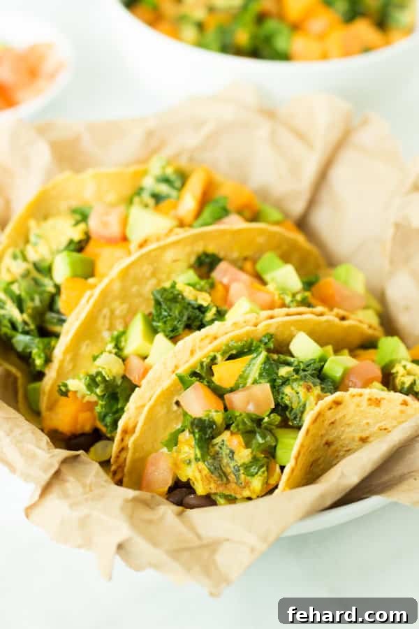 Three vibrant Superfood Breakfast Tacos served in a rustic basket, ready to be enjoyed
