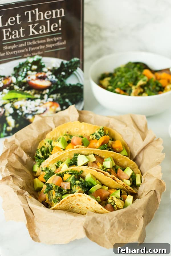 Beautifully plated Superfood Breakfast Tacos with the 'Let Them Eat Kale!' cookbook in the background