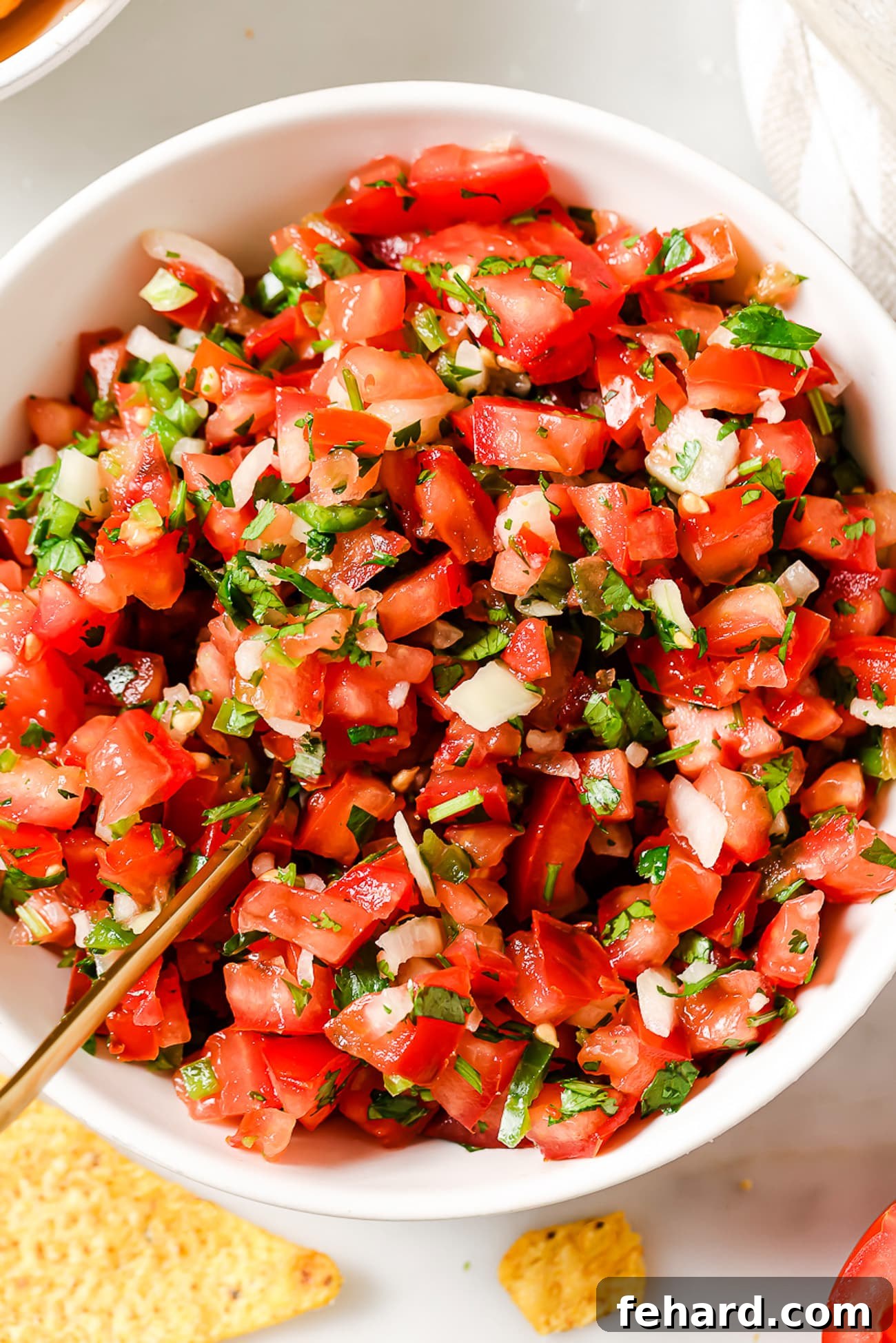 Vibrant Fresh Salsa 6 An inviting overhead view of a large bowl filled with vibrant homemade Pico de Gallo, showcasing its fresh, chunky texture.