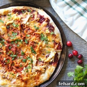 Pizza with Turkey and Cranberry BBQ Sauce on pizza pan.