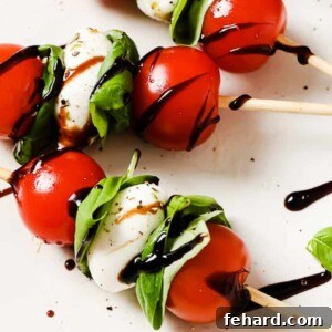 Fresh Caprese Bites 9 close up of caprese skewers on a white plate
