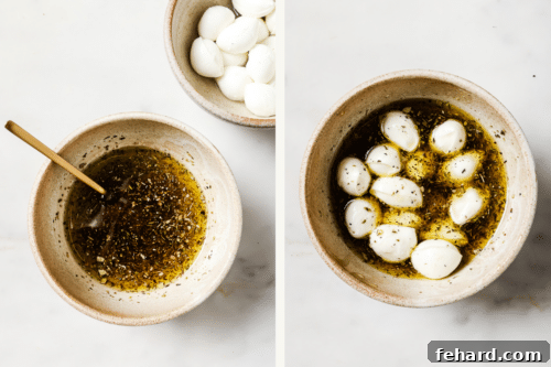 Fresh Caprese Bites 10 mozzarella mini balls in a bowl with olive oil and spices