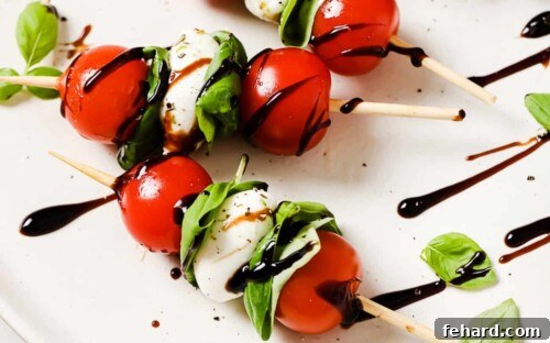 Fresh Caprese Bites 12 close up of caprese skewers on a white plate