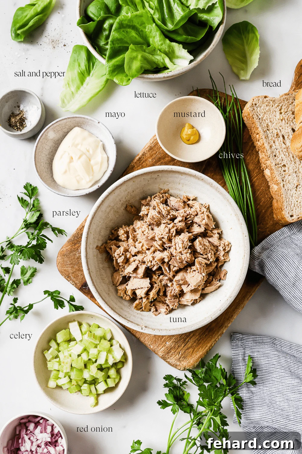 Small bowls of pre-measured ingredients on a white countertop.