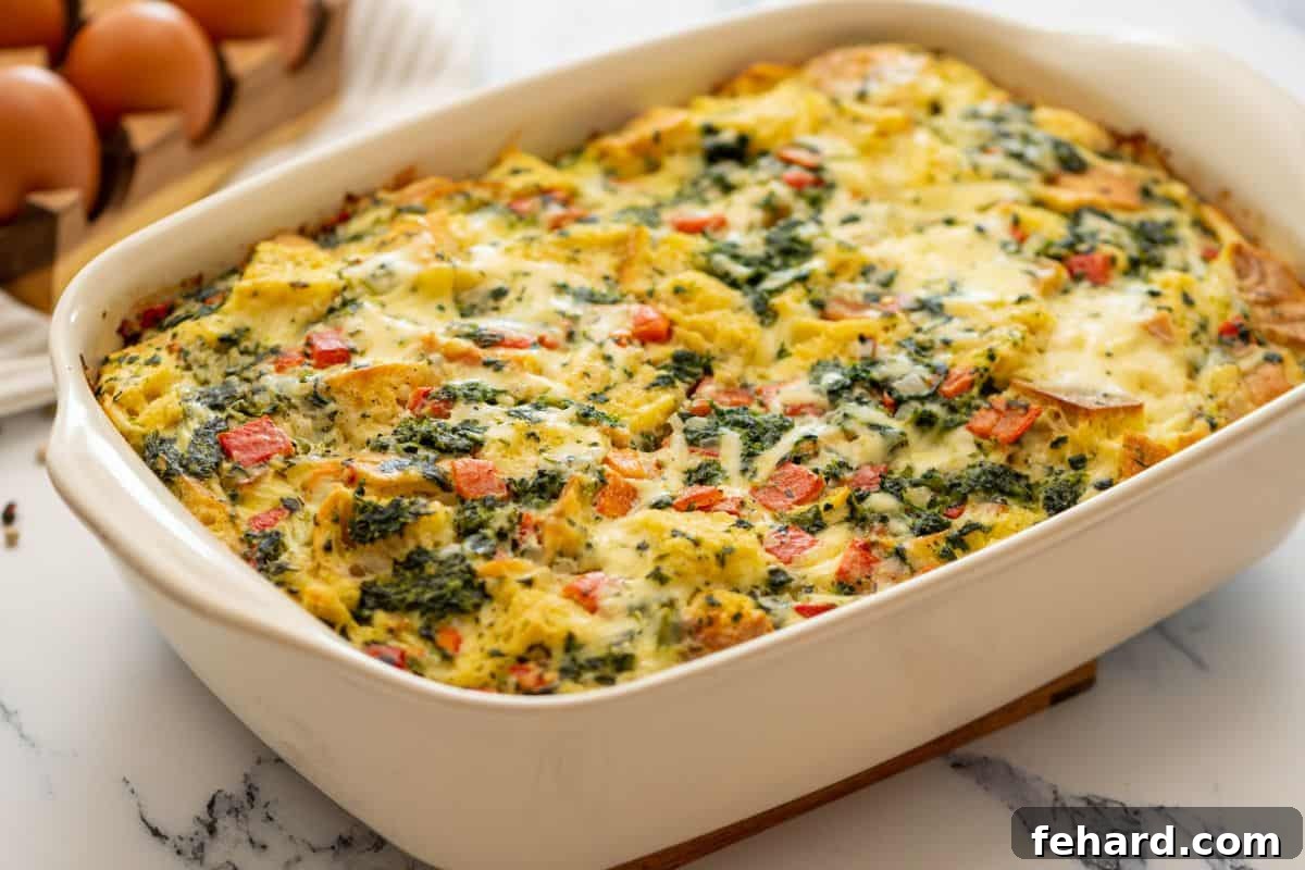 Baked breakfast strata in casserole dish.
