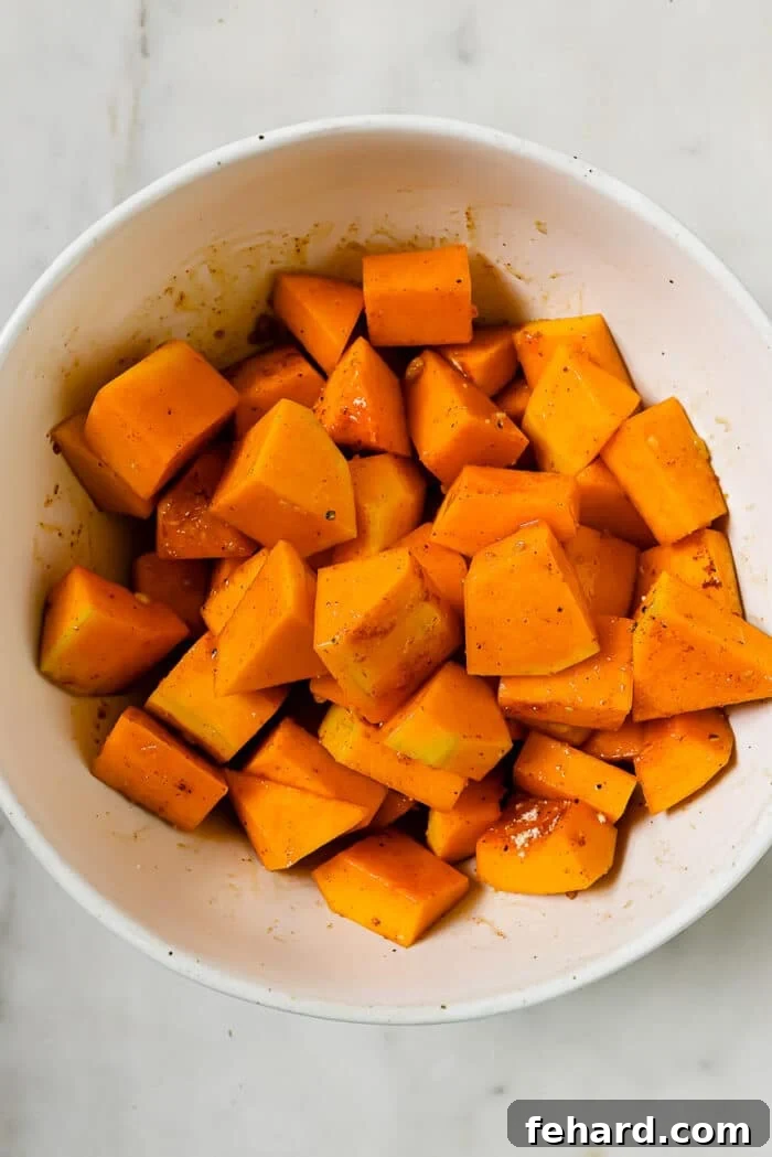 Golden Air Fryer Butternut Squash 8 An overhead view of the squash coated in seasonings.