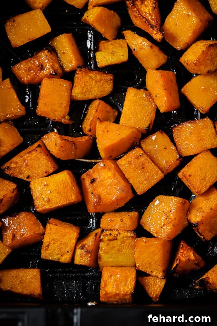 Golden Air Fryer Butternut Squash 10 A close-up of air fryer butternut squash in the air fryer basket.