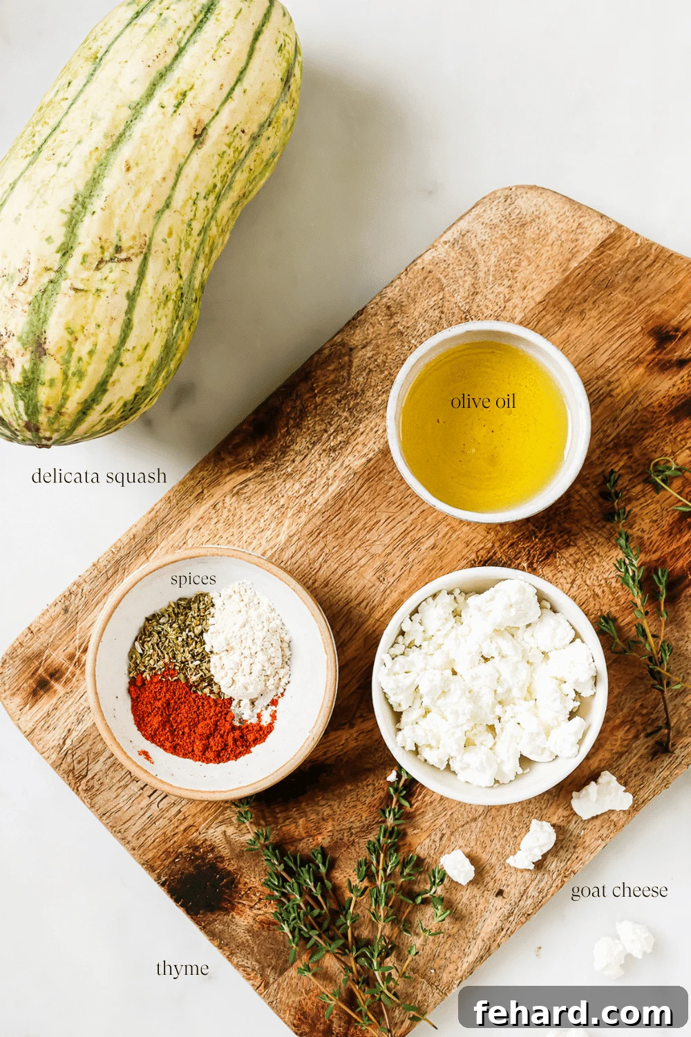 Caramelized Delicata Squash 3 An overhead view of prepped ingredients on a wooden cutting board.