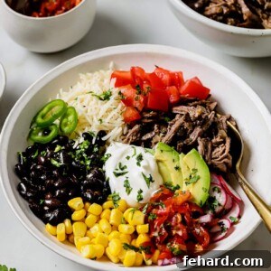A vibrant Barbacoa Burrito Bowl with slow-cooked beef, fresh vegetables, and delicious toppings, ready to serve.
