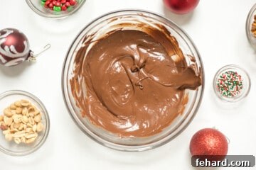 Melted chocolate in a large mixing bowl, ready for Christmas Bark toppings.
