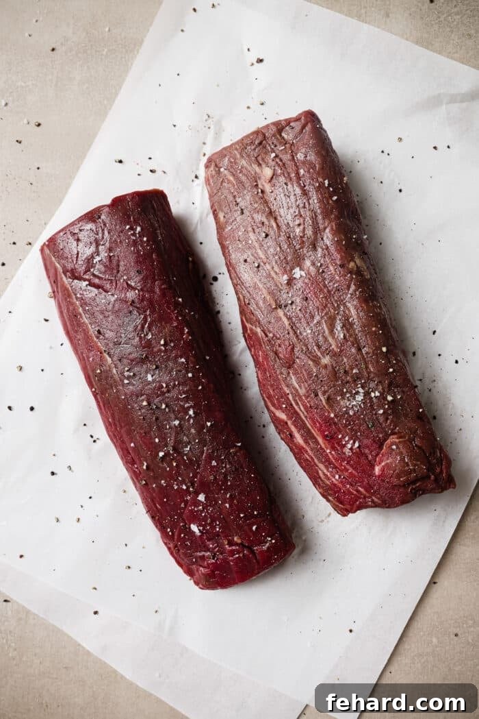 Golden Garlic Butter Tenderloin 5 Two beef tenderloins seasoned with salt and pepper.