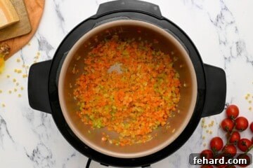One Pot Wonder Pasta Fagioli 4 Sauteed onions, carrots, celery in inner pot of Instant Pot.