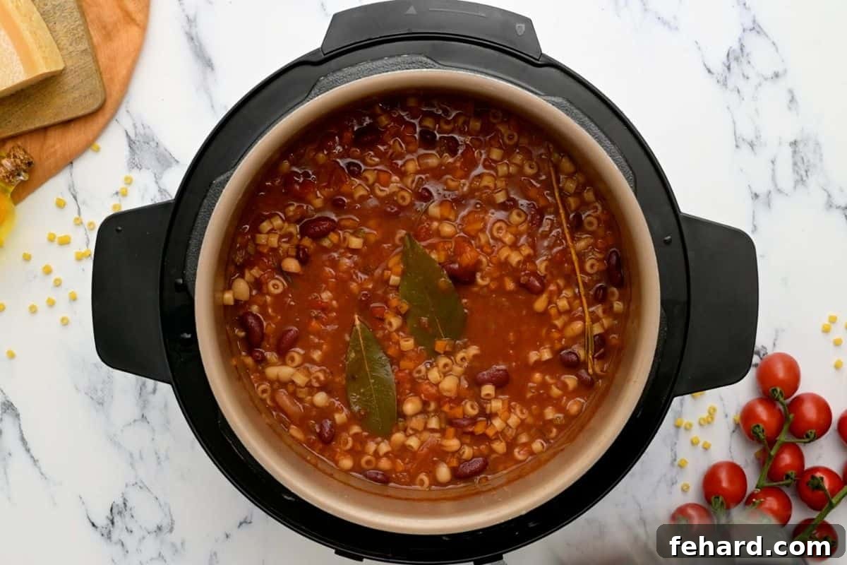 IP Pasta Fagioli Soup The perfectly cooked Pasta Fagioli soup inside the Instant Pot's inner pot immediately after pressure cooking and lid removal.