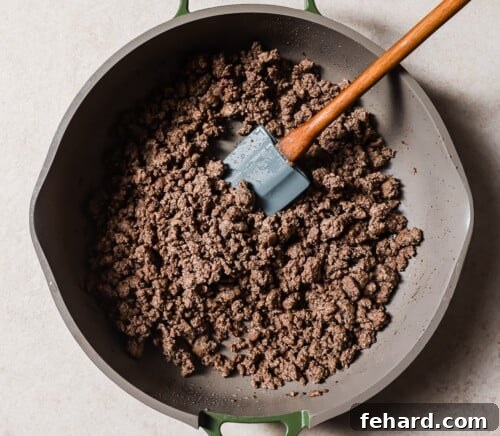 cooked ground beef in a skillet