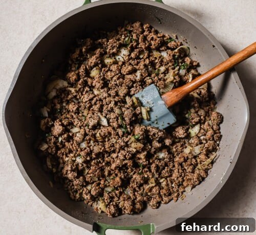 cooked ground beef in a skillet
