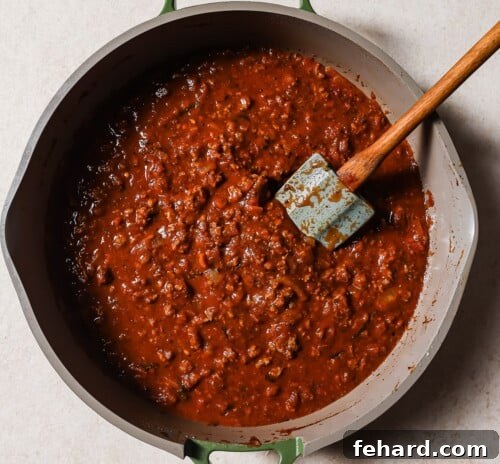 ground beef and tomato sauce in a skillet