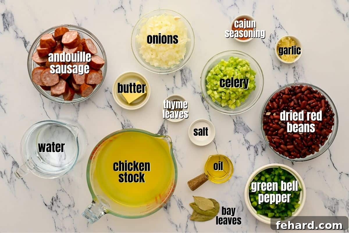 Labeled ingredients for Red Beans and Rice, including dried beans, sausage, and vegetables, neatly arranged on a kitchen counter.