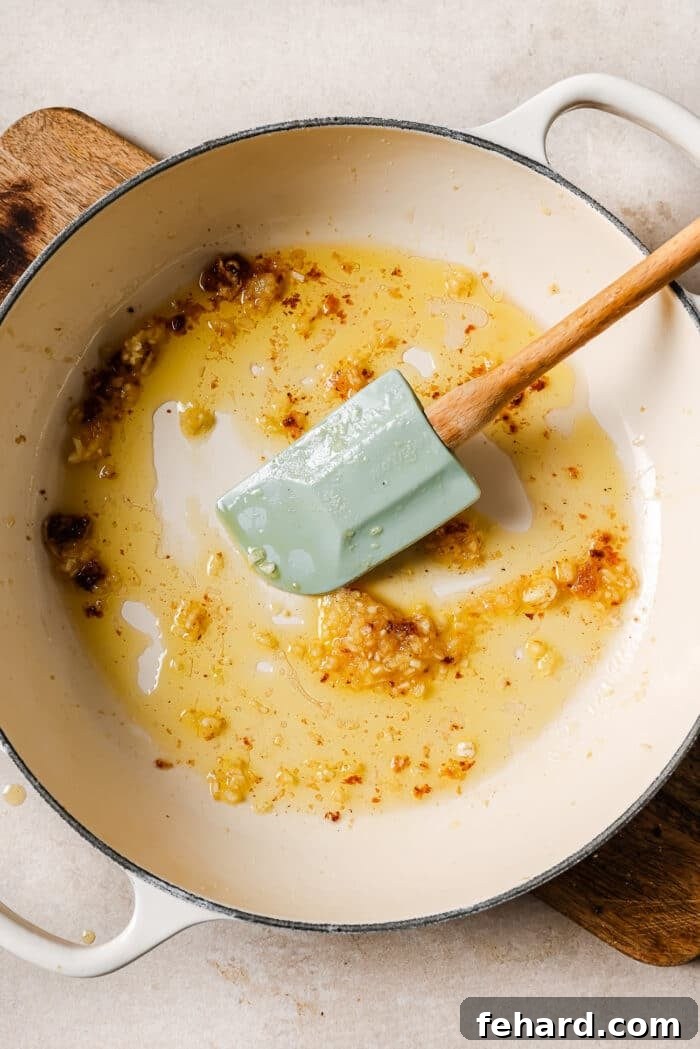 Sticky Honey Garlic Chicken Breast 6 Finely minced garlic sizzling gently in olive oil and melted butter in a large white skillet.