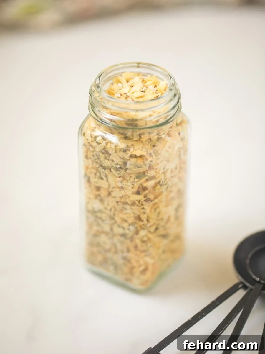 Lipton Dry Onion Soup Mix Recipe Homemade Dry Onion Soup Mix in small glass jar with measuring spoons on the side.
