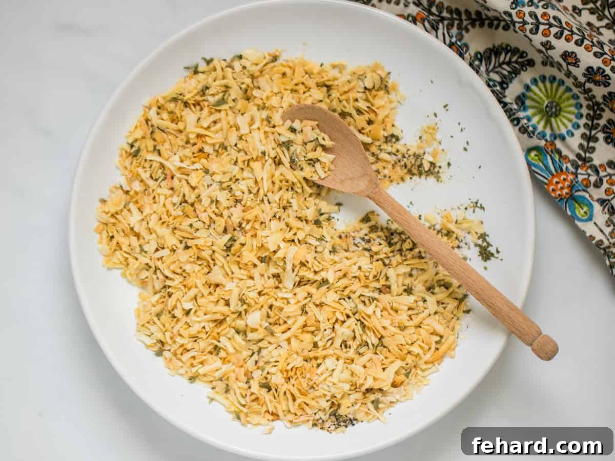 Dry Onion Soup Mix Recipe Onion flakes, onion powder, garlic powder, parsley, salt, pepper, and celery salt mixed together in white bowl to form Dry Onion Soup Mix.