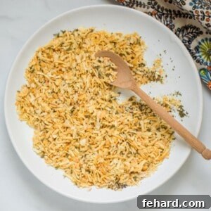 Onion flakes, onion powder, garlic powder, parsley, salt, pepper, and celery salt mixed together in white bowl to form Dry Onion Soup Mix.