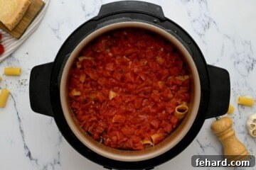 Rigatoni with sausage and tomatoes in instant pot after pressure cooking.